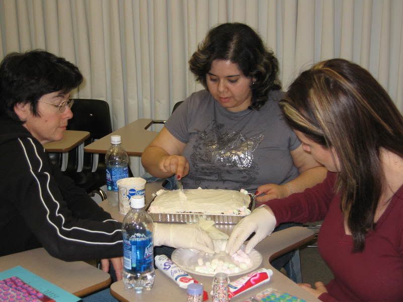 GROUP WORKING ON SINDERELLA CAKE ONE MORE TIME