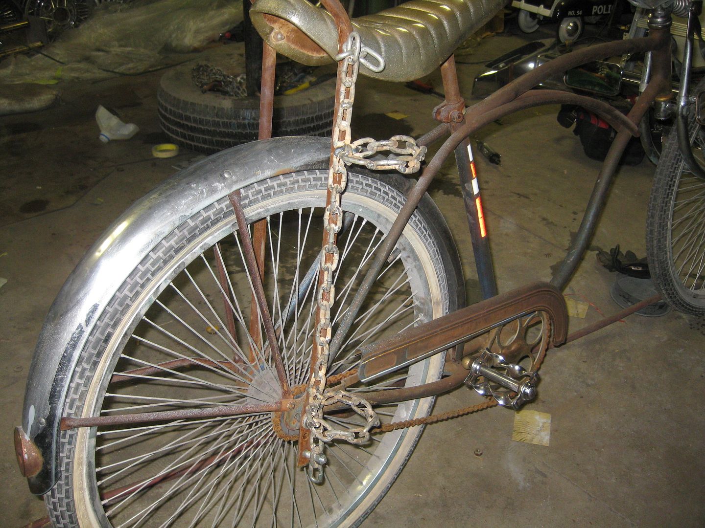 a baseball bat holder for a bike